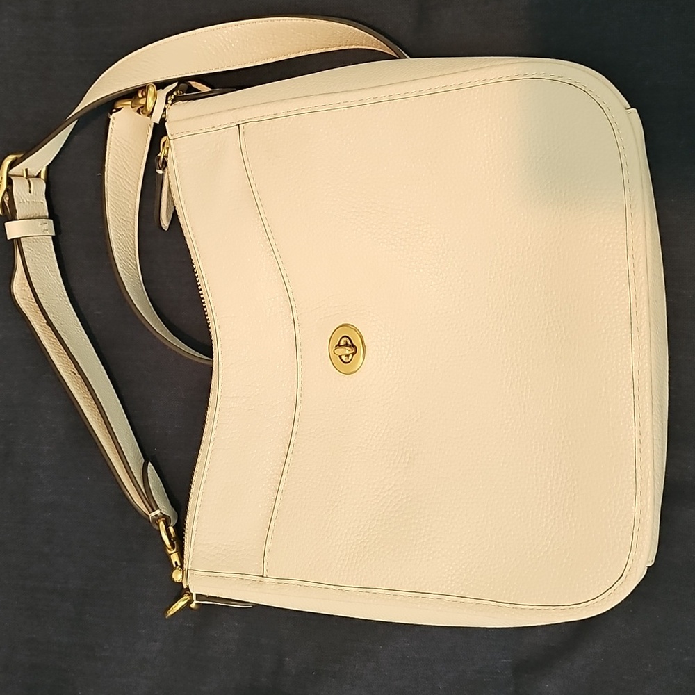 The Coach Polished Pebble Leather Cream Crossbody Bag